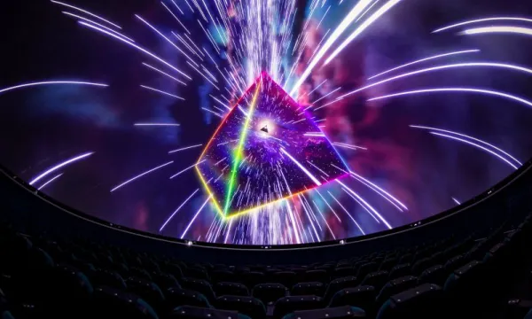 Promotional image of a dome screen showing Pink Floyd's Dark Side of the Moon Planetarium Show