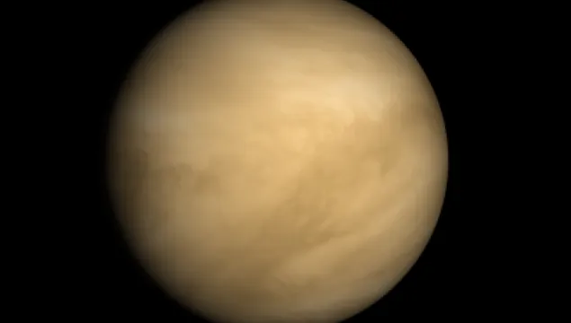 Planet Venus - swirling yellowish beige clouds cover the planet