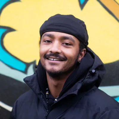 Artist Keyane Ishmail Nwakalo-Allman (artist for the Street Scene mural) 